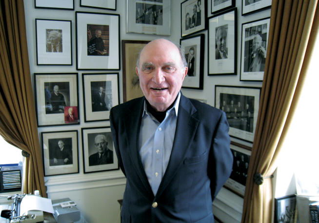 Photos on the walls of Norman Dorsen '50's office at NYU attest to the remarkable breadth of his career.Photo: Thomas F. Ferguson '74